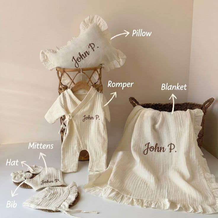 Personalized baby gift set with organic muslin blanket, romper, pillow, hat, mittens and bib